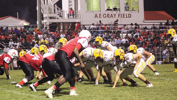 Photo by Christy Boyte/ The Prentiss defense digs in and awaits the snap from the Enterprise Yellow Jackets during their district game Friday night.  