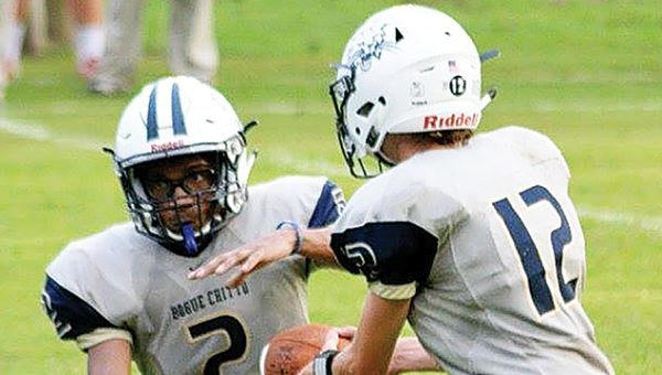 Photo by Stacy Leake/ Quarterback Trey Nettles hands off to running back Demarcus Godbolt during their game against Mount Olive Friday.  