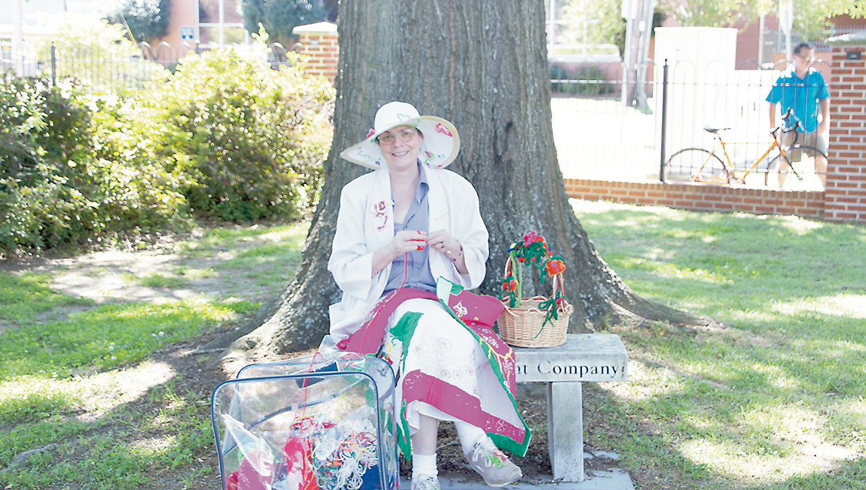 Photos submitted/ A Brookhaven Regional Arts Guild artist crochets during “Music and Art at Trinity Park” in April. The Thursday lunch event will continue during October. The musician lineup this month includes, from top left, Hewitt Family Band, Betsy Berryhill, Andi Cotton and Jordan Nettles. The event starts every Thursday at noon in Trinity Park at 224 West Monticello St.