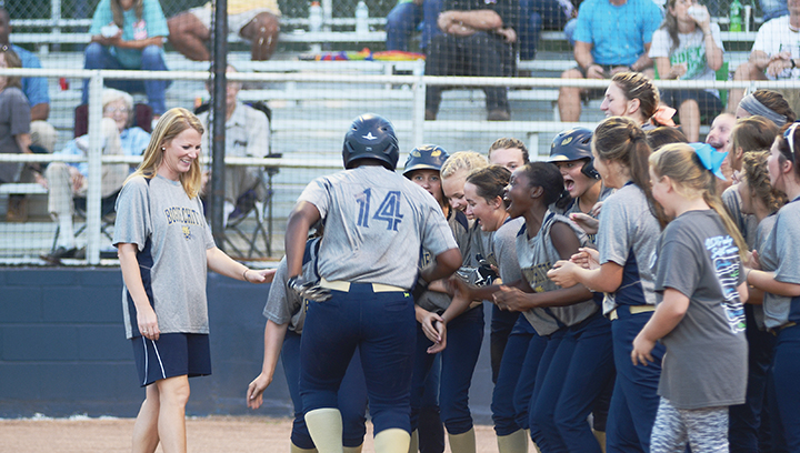 Photo by Anthony McDougle /Lineka Newson approaches home plate as her teammates await her after she hit a home run early in their win over the Bears Thursday.
