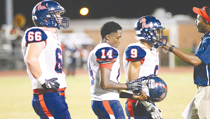 Photo by Anthony McDougle /Freshman quarterback Byrion Robinson (center) will take the helm of the Ole Brook offense tonight.