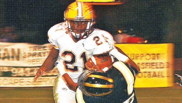 Photo by Christy Boyte/ Enterprise’s Darren Richardson tries to break a Bassfield defenders’ tackle Friday night in Bassfield.