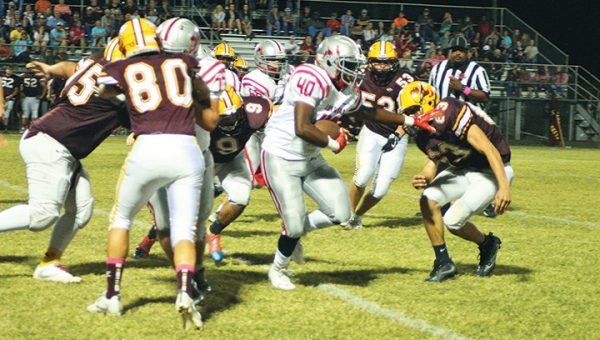 Photo by Lydia King/  Loyd Star’s Zac Arnold attempts to evade Enterprise defenders during the Sting Bowl Friday night.  