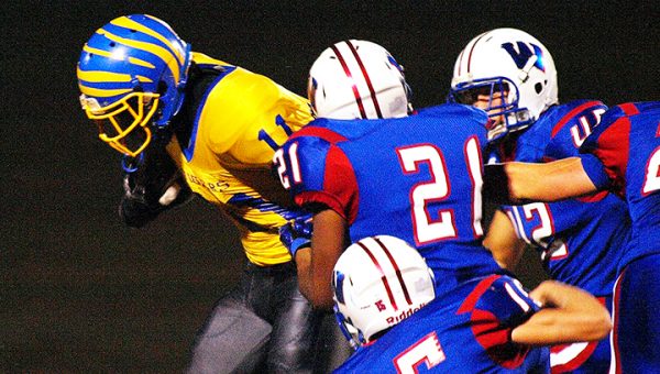 Photo by Tracy Fischer/ A host of Wesson defenders attempt to bring down a Jefferson County ball carrier in a district tilt between the squads Friday.