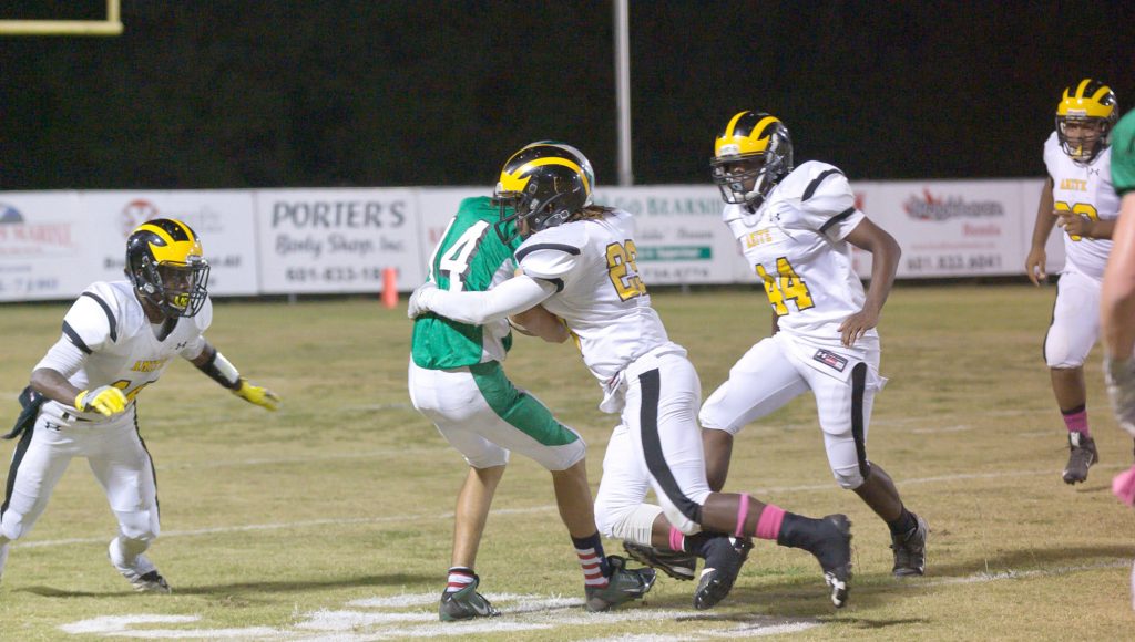 Photo submitted.West Lincoln’s Austin Griffin is tackled by two Amite defenders recently. The Bears will face Prentiss Friday.