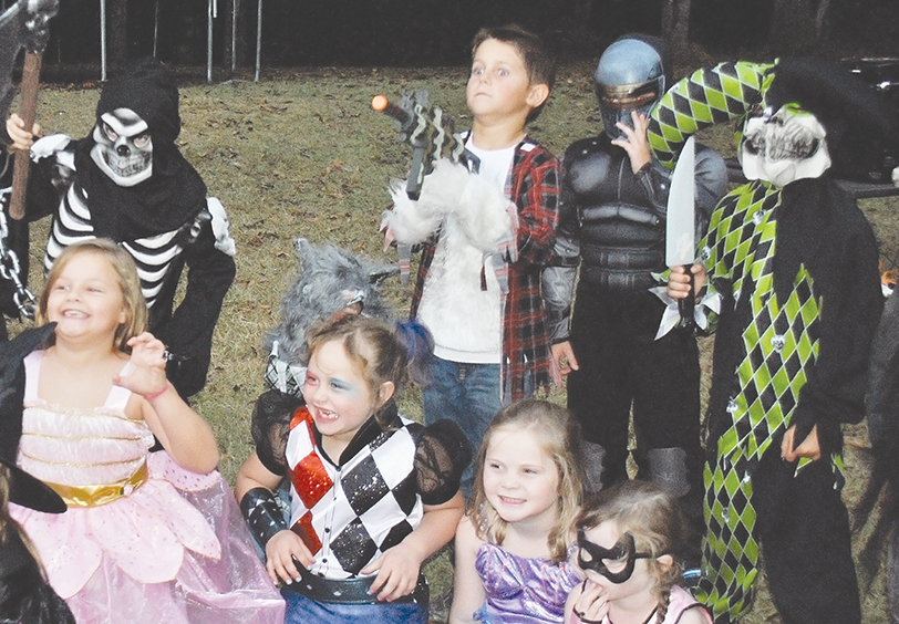 Photo by Aaron Paden/Back row, Garson Haley (left), Case Simmons, Jameson Pannel and Paxton Leggett; and front row, Chloe Emory, Magnolia Jones, Avery Tanksley and Addie Tanksley make scary faces Saturday at Jones’ Scare Away Cancer party. About two dozen of her friends from Brookhaven Academy celebrated the end of her treatment for B-cell acute lymphoblastic leukemia with a Halloween bash at the school.
