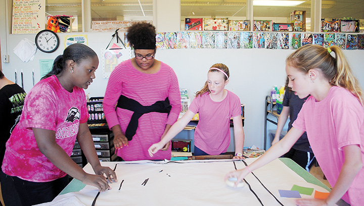 Photo by Aaron Paden/Cassidy Robinson (left), Kaylin Redd, Merritt Wolfe and Ellie Slay, seventh grade students at Alexander Junior High, recently worked together to design and build a costume for Quest’s annual Halloween competition. Time and supplies were limited, and students had work together to finish their costume.