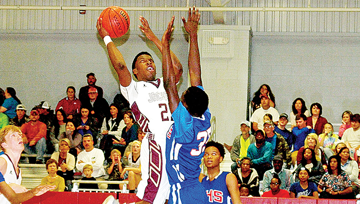 Photo by Tracy Fischer/Enterprise’s No. 23 Dwayne Pendleton goes for the net against Wesson’s No. 35 Johntavious Smith.