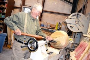 Photo by Donna Campbell/Maurice Smith uses a lathe and a variety of chisels to transform cut tree trunks into beautiful one-of-a-kind bowls in his workshop in East Lincoln.