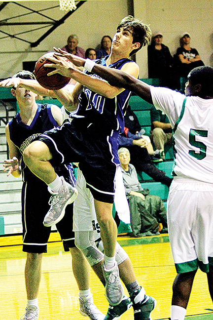 Photos by Sherylyn Evans/Brookhaven Academy’s Luke Jackson goes up for a shot against Natchez Cathedral’s William Doss Monday night.