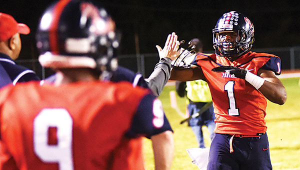 Photo by Ben Hillyer/ Brookhaven’s Damarrell Leggett is congratulated on the sideline during Friday’s win over Natchez.