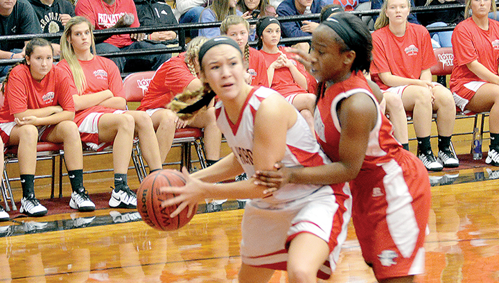 Photo by Chris King/Loyd Star’s Lydia Britt (2) goes for two as Johniqua James (32) of Brookhaven High School tries to defend the goal. The Lady Hornets defeated the Lady Panthers 57-39. The Panthers defeated the Hornets 97-58 in boys’ action.