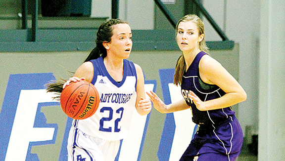 Photo by Sherylyn Evans/Brookhaven Academy’s Sophie Wilson looks for an open teammate while being guarded by Centreville’s Katie Lynn McDowell at a recent game.