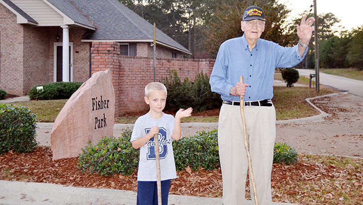 Photo by Donna Campbell/Cecil Rhodes, 96, and Carson Barrington, 5, have been walking partners in Fisher Park for three years. They regularly wave to motorists passing by on Halbert Heights Road in the afternoons. Carson is the son of Steve and Laura Barrington of Brookhaven.