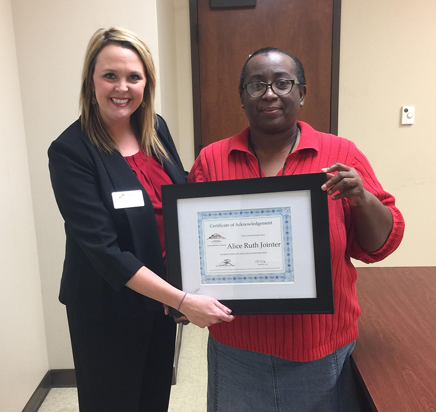 Photo submitted/Jessica Breazeale with Reed's Metals congratulates Alice Ruth Jointer, of Wesson, with a certificate acknowledging her contest win. She'll receive a new metal roof for her home.
