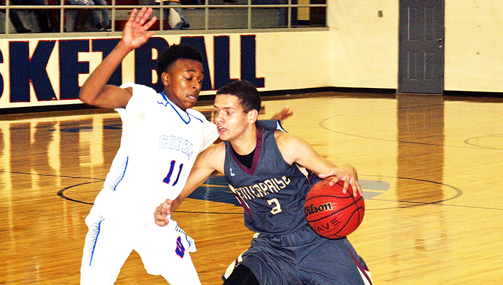 Photo by Tracy Fischer/Trevor Freeman (3) is guarded by JD Allen (11) in the Wesson vs. Enterprise game Friday.