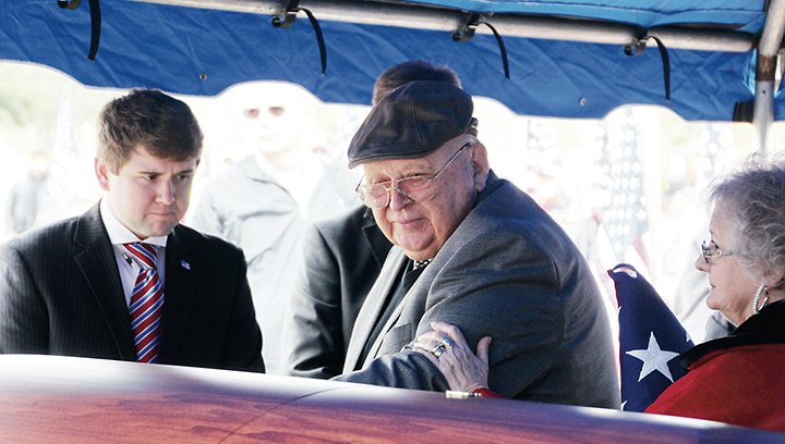 Photo by Alex Jacks/Frank Springs, the oldest living relative of Fireman 1st Class Jim H. Johnston, says one last goodbye to his uncle's remains. Johnston perished 75 years ago on the USS Oklahoma during Pearl Harbor.