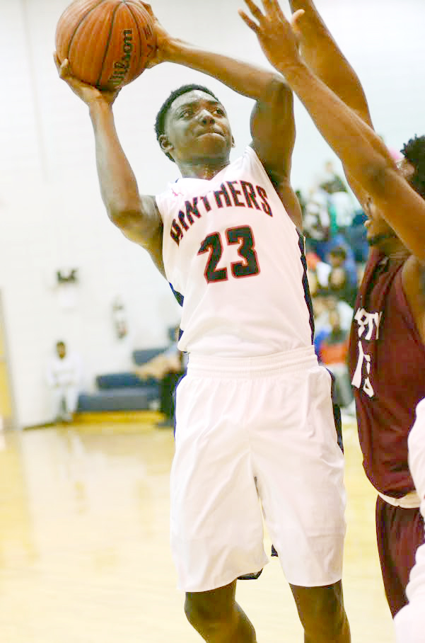 Photo by Dylan Rubino/Lafollette Bogan (23) tries to convert the put-back Tuesday night against Terry.
