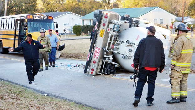 Propane truck overturns in crash with school bus; no injuries reported