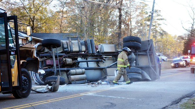 Propane truck overturns in crash with school bus; no injuries reported