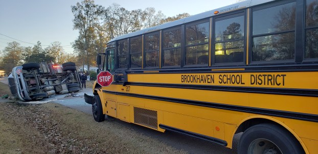 Propane truck overturns in crash with school bus; no injuries reported