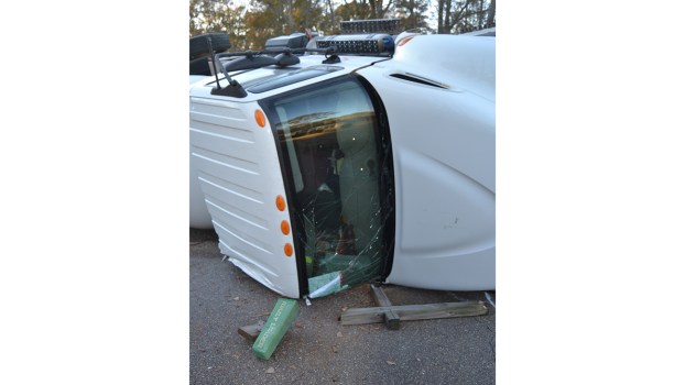 Propane truck overturns in crash with school bus; no injuries reported