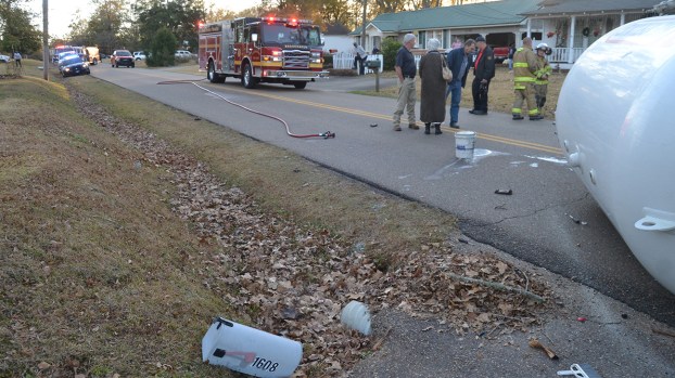 Propane truck overturns in crash with school bus; no injuries reported