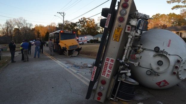Propane truck overturns in crash with school bus; no injuries reported